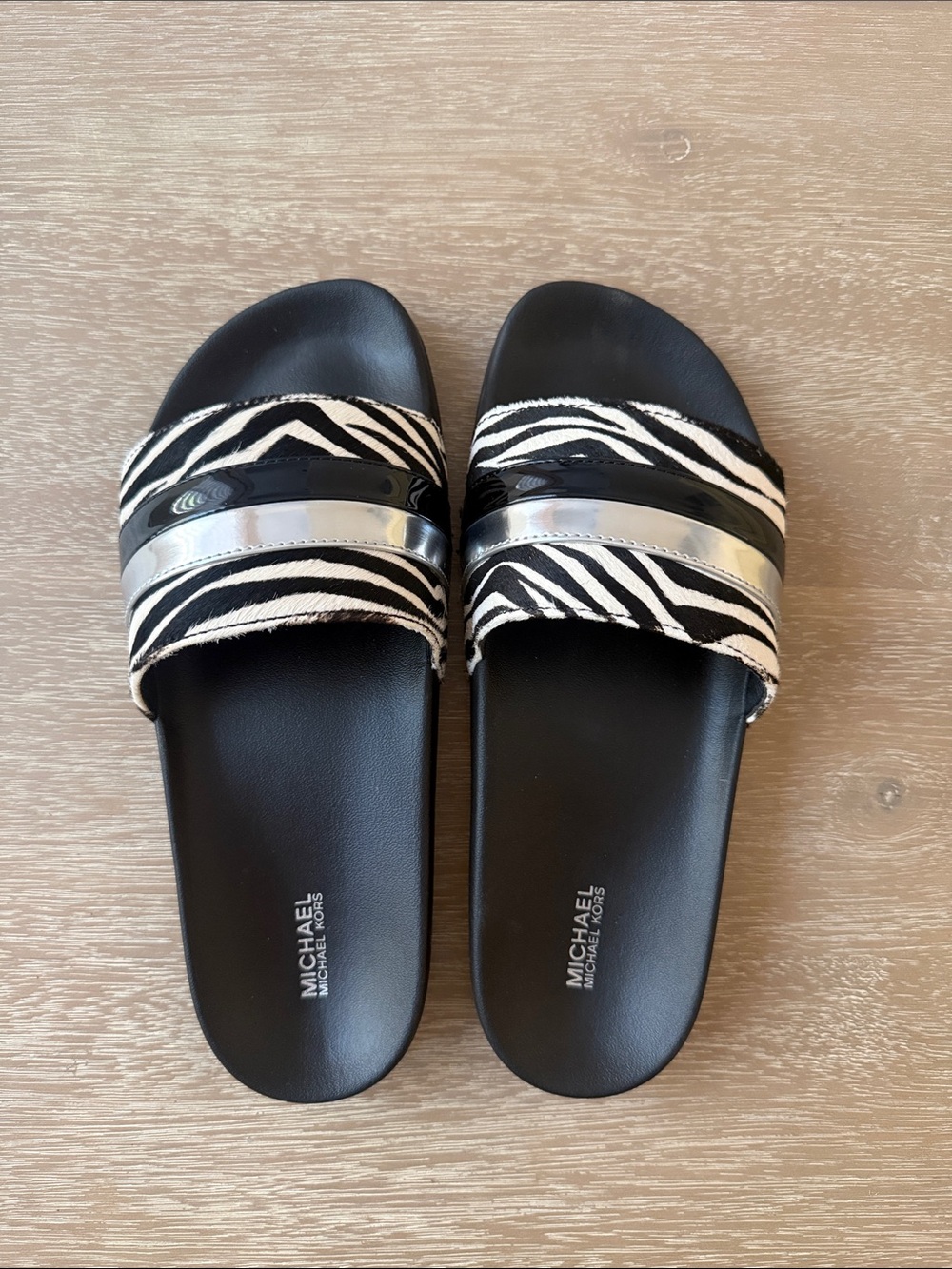 MICHAEL Michael Kors Black and White Zebra Slide Sandals with Silver Accent